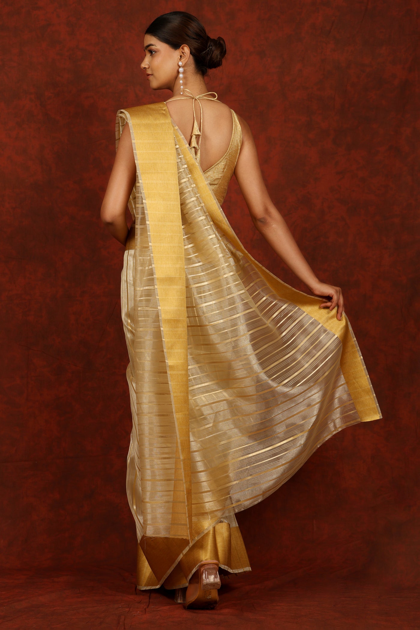 Golden color organza Saree with silver foil print Stripes